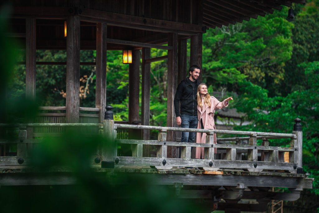 couple pointing forward in nature in Nara Japan photoshoot
