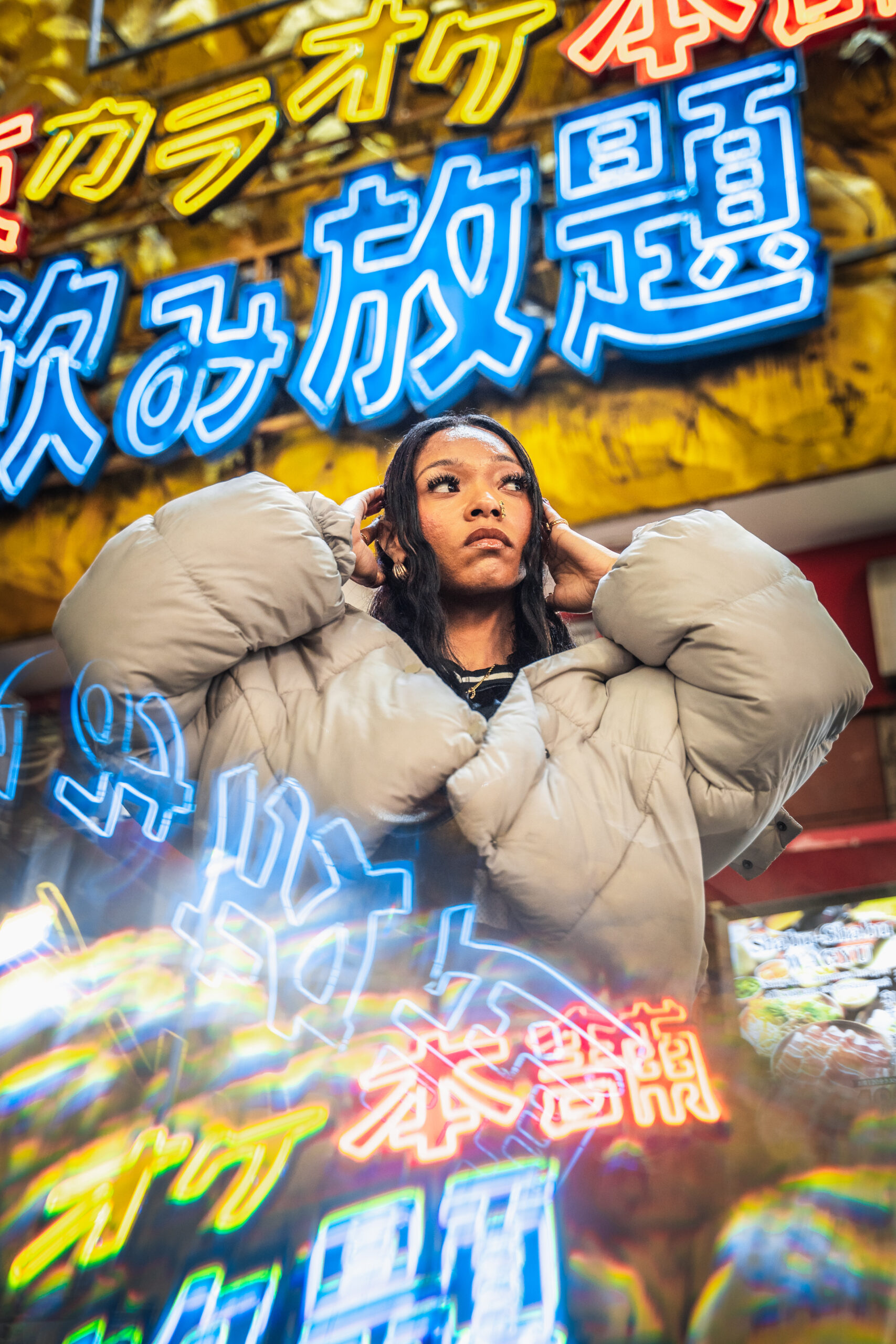 female portrait posing with neon reflections in Tokyo at night