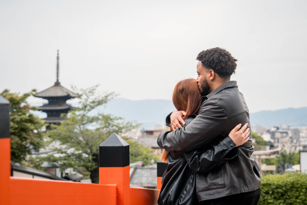couple hugging with Yasaka Pagoda in Kyoto in the background